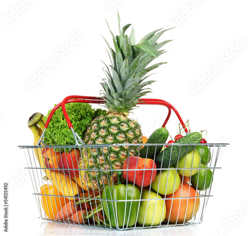 Assortment of fresh fruits and vegetables in metal basket,