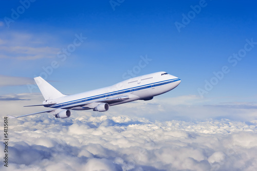 passenger airplane in the clouds.