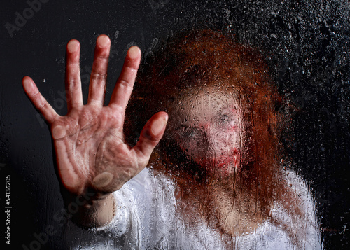 Horror Themed Image With Bleeding Freightened Woman photo