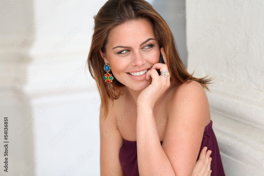 Happy woman talking on cell phone Happy woman talking on cell phone