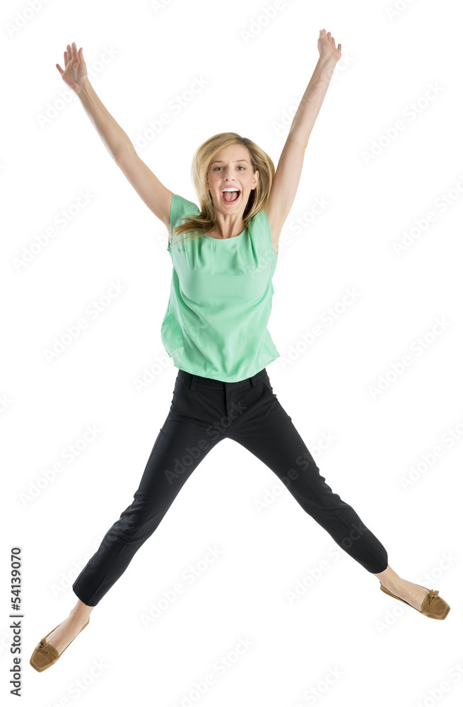 Obraz premium Excited Woman With Arms Raised In Mid-Air
