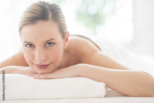Woman Smiling While Relaxing In Health Spa