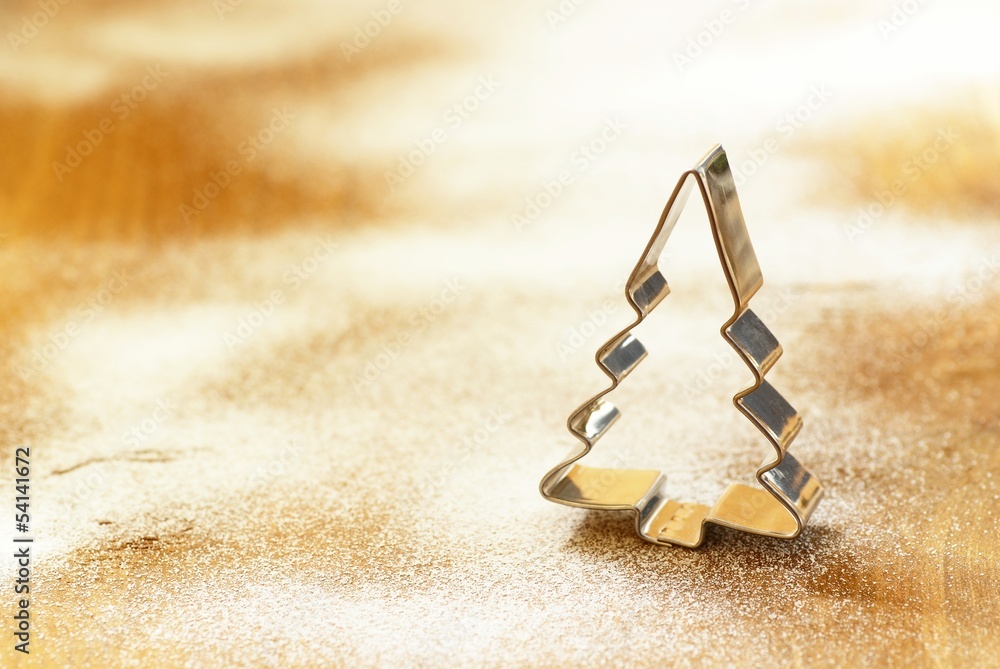 Cookie cutter on flour or sugar background Cookie cutter on flour or sugar background