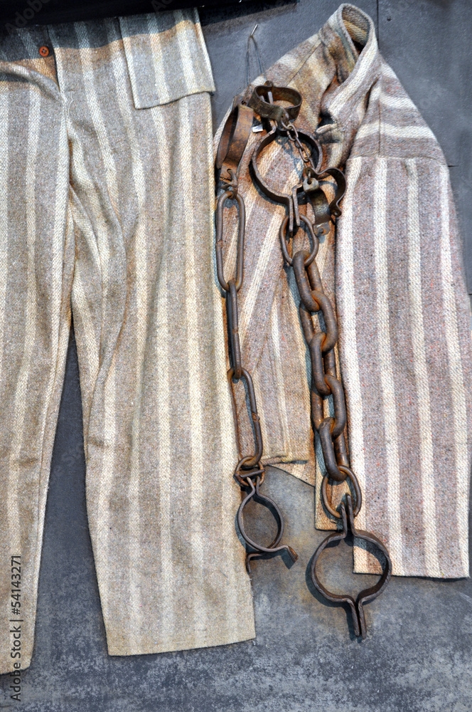 Chain, fetter and prisoner clothes in a prison Stock Photo Adobe Stock