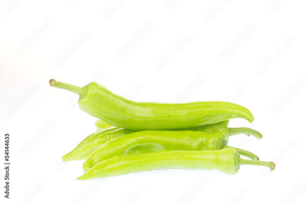 The green peppers on a white background The green peppers on a white background