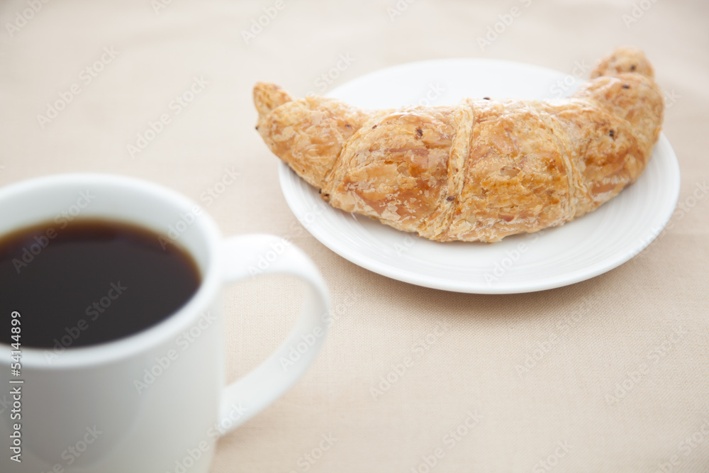 Croissant and a cup of coffee Croissant and a cup of coffee