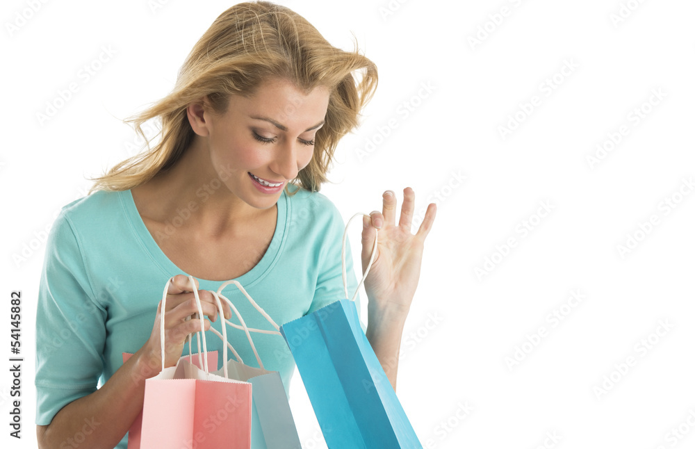 Beautiful Young Woman Looking Into Shopping Bags Beautiful Young Woman Looking Into Shopping Bags