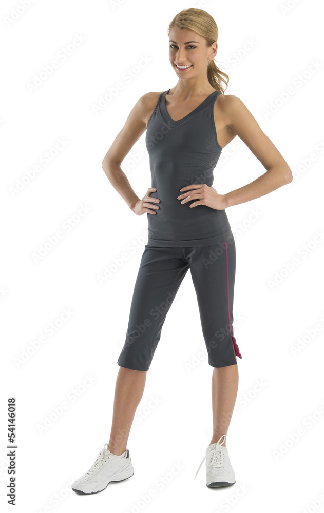 Fit Young Woman In Sports Clothing With Hands On Hips Fit Young Woman In Sports Clothing With Hands On Hips