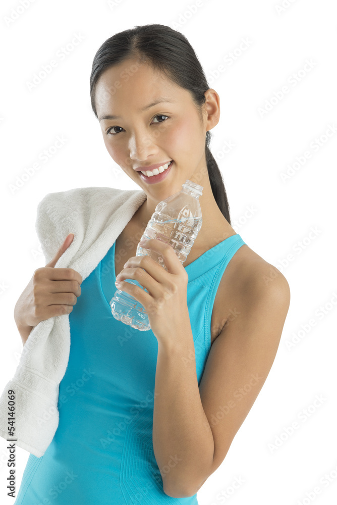 Happy Mid Adult Woman With Towel And Water Bottle Happy Mid Adult Woman With Towel And Water Bottle