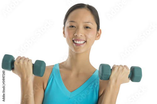 Happy Mid Adult Woman Lifting Weights