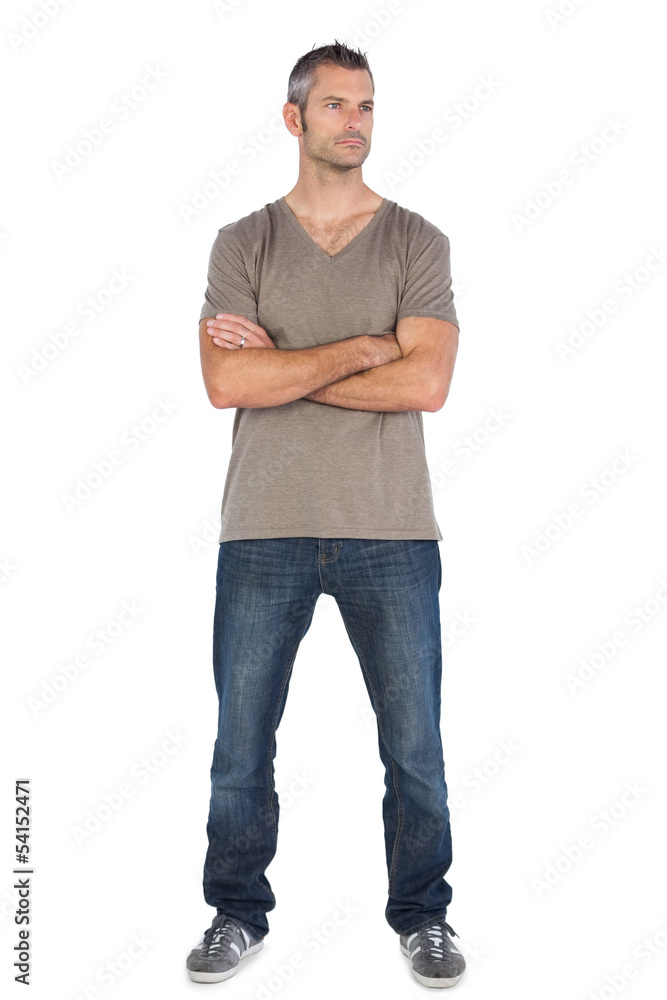 A man standing with arms crossed A man standing with arms crossed