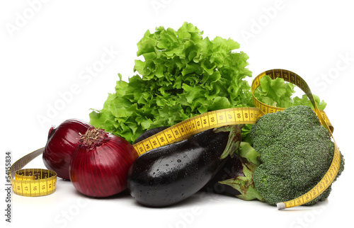 Delicious group of vegetables and a measurent tape photo