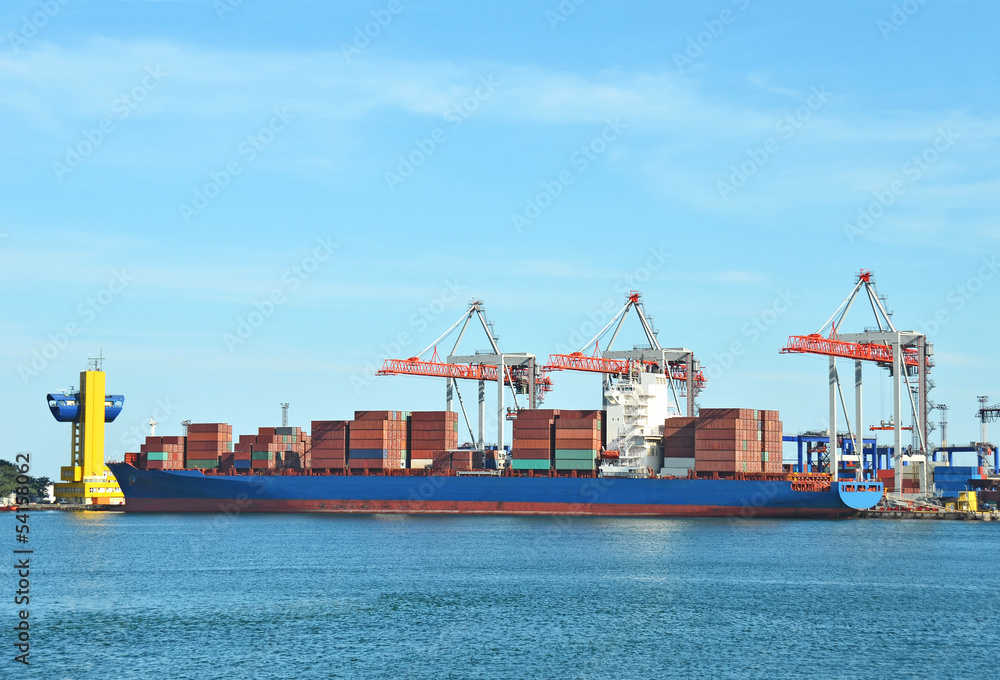 Container stack and ship under crane bridge Container stack and ship under crane bridge