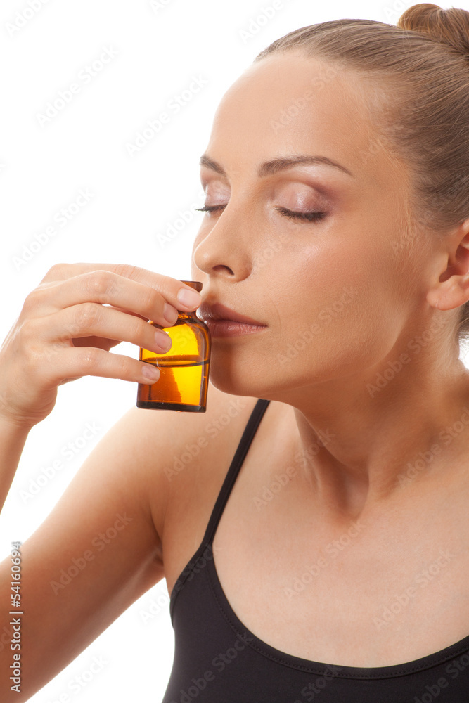woman holding a bottle of medicine, isolated on white background woman holding a bottle of medicine, isolated on white background