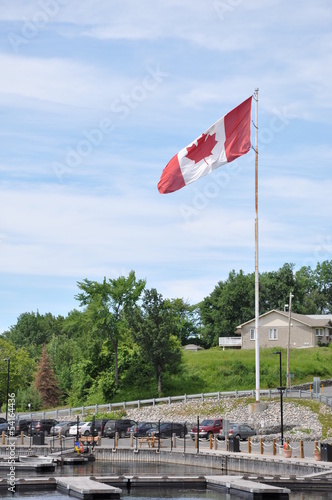 Canadian flag flying high in marina