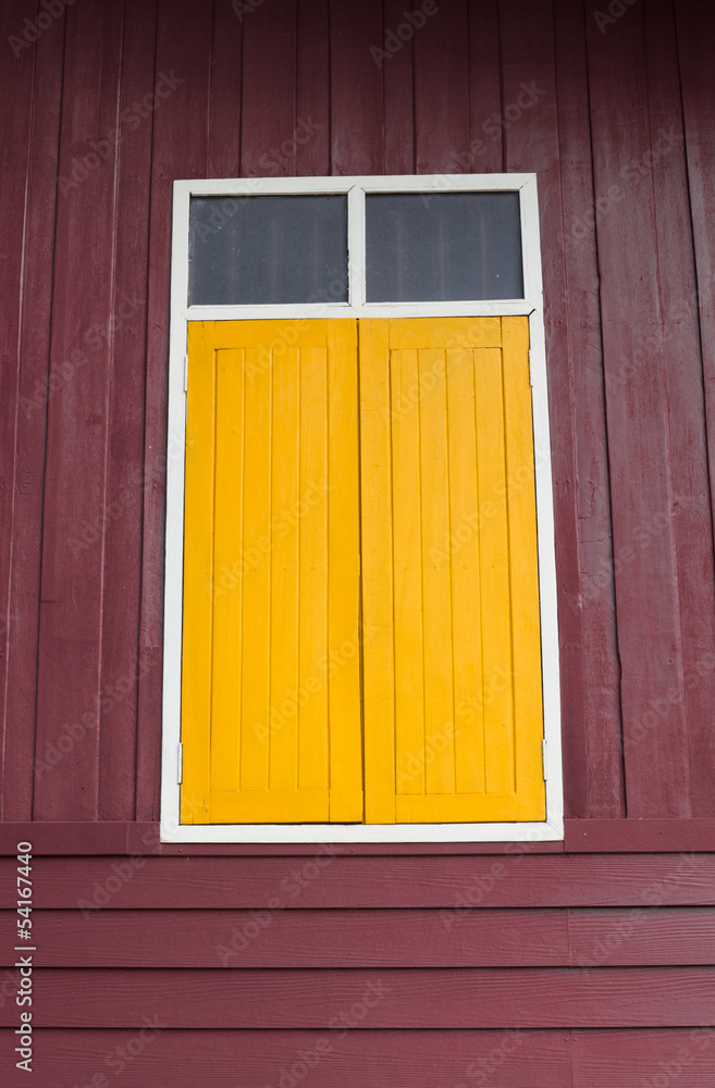 Yellow window on Wooden background Yellow window on Wooden background