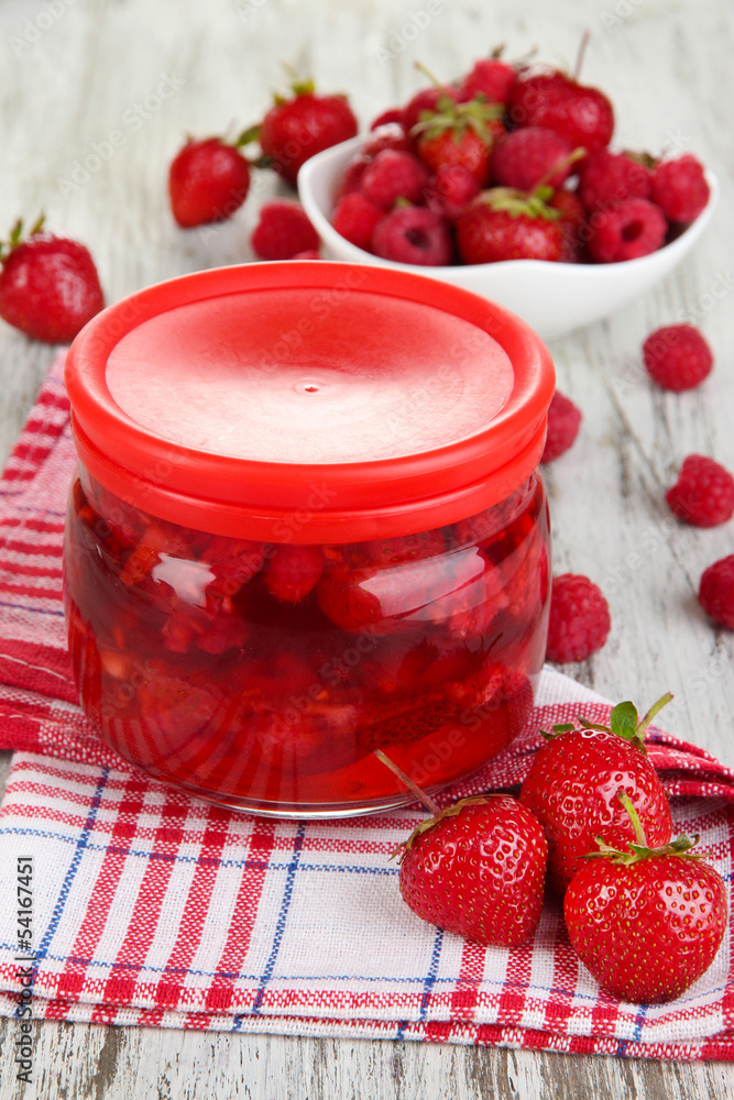Home made berry jam on wooden table Home made berry jam on wooden table