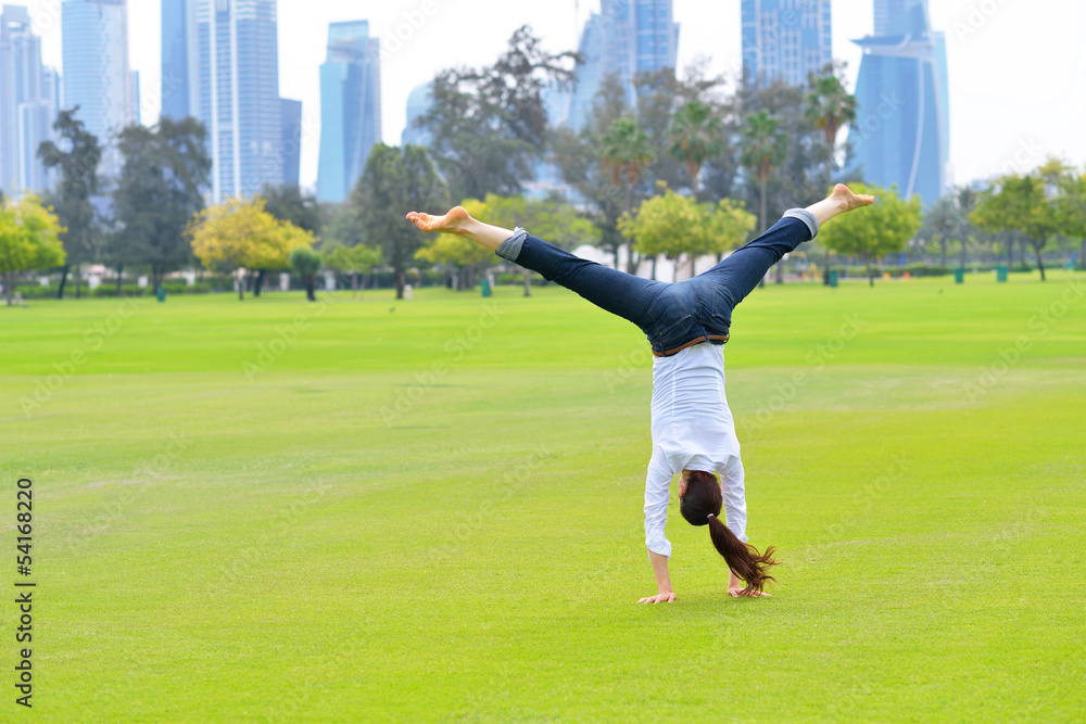 young woman jumping in park