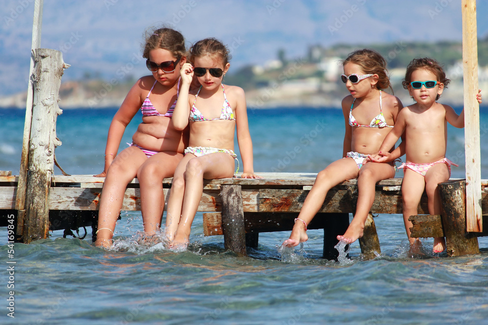 Little girls on the pier