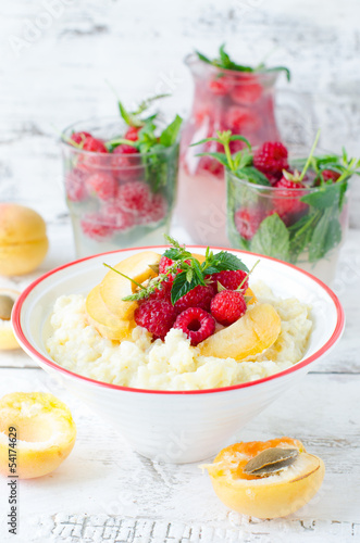 Milk porridge with raspberries and apricots