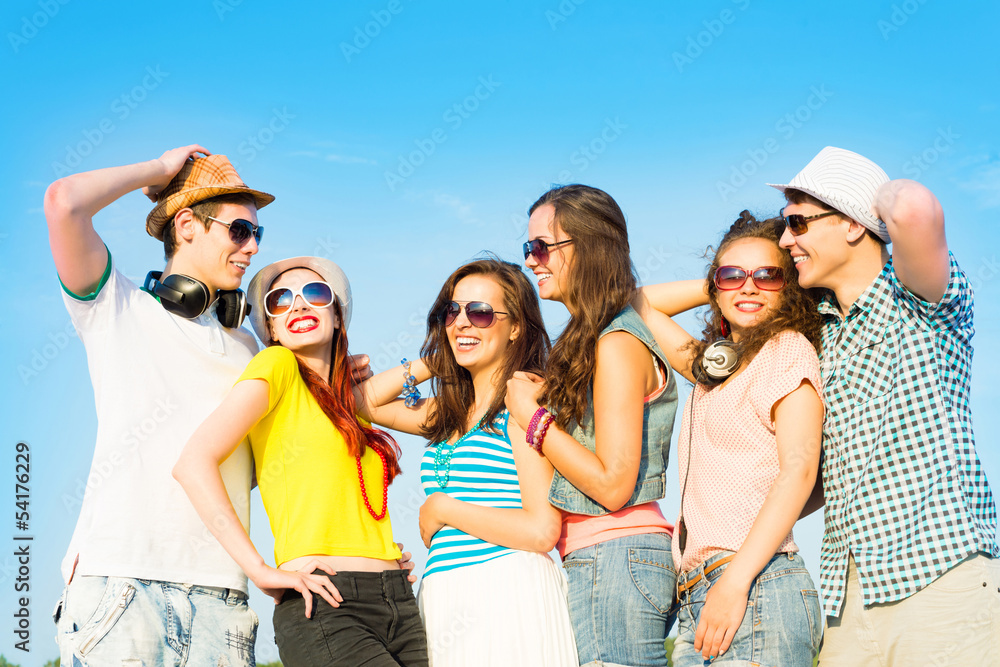 group of young people wearing sunglasses and hat group of young people wearing sunglasses and hat