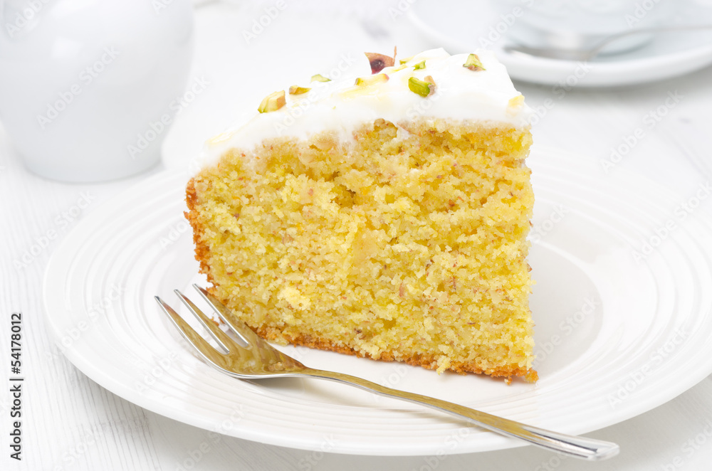 piece of orange cake decorated Greek yogurt, honey, pistachios piece of orange cake decorated Greek yogurt, honey, pistachios
