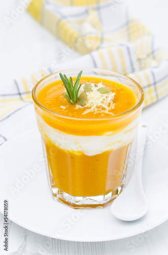 pumpkin soup with shrimp, yogurt and rosemary in a glass