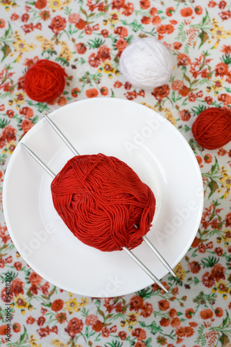 White plate, the spokes, red and white ball on the background photo