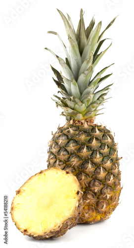Juicy pineapple with slices isolated on white background