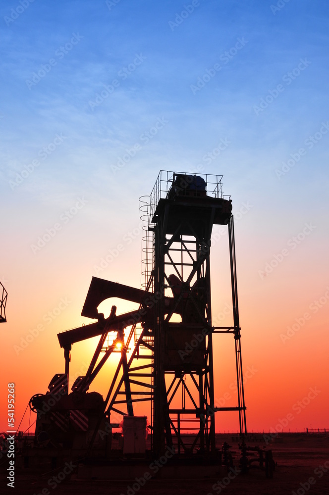 Oil Pump on orange sunset Oil Pump on orange sunset