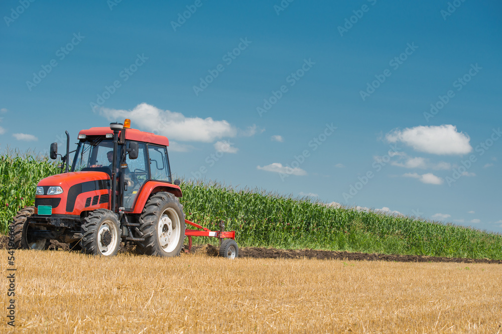 Fototapeta premium Tractor plowing
