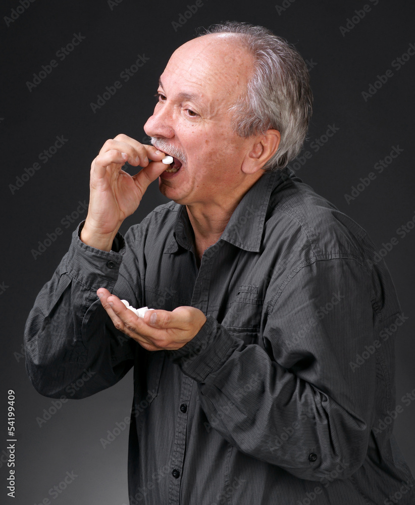 Man holding handful of pills Man holding handful of pills