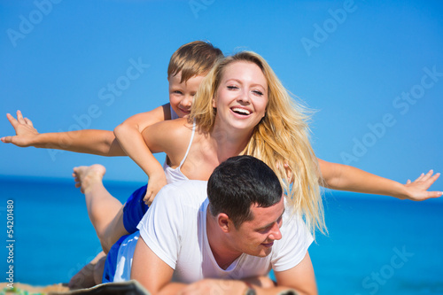 Family on the beach © Kirill Grekov
