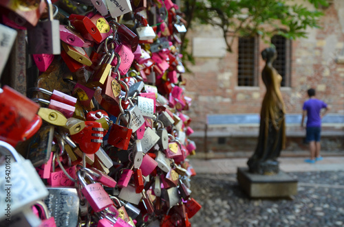 Love locks by a monument of Juliet photo