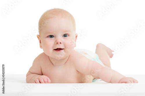 smiling baby boy lying on t...