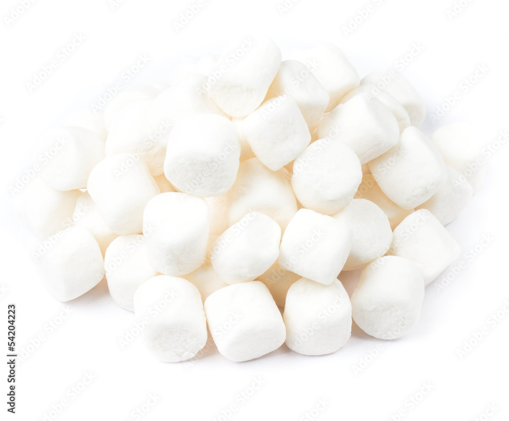 A pile of mini white puffy marshmallows on white background. Clo A pile of mini white puffy marshmallows on white background. Clo