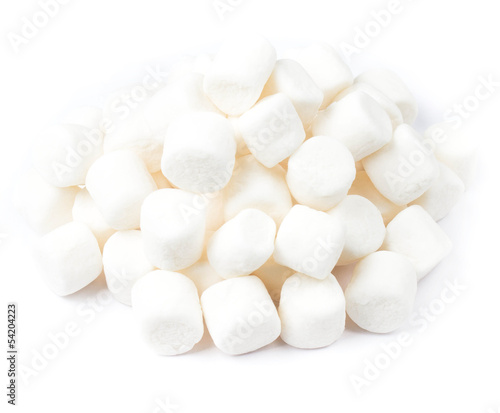 A pile of mini white puffy marshmallows on white background. Clo