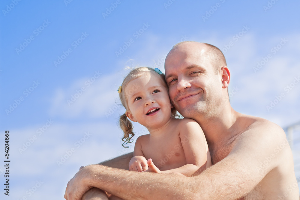 Smiling little girl with her father Smiling little girl with her father