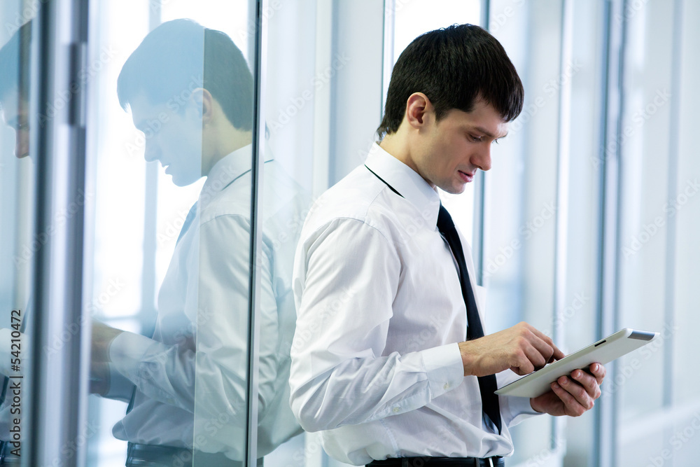 young  business man holding a digital tablet