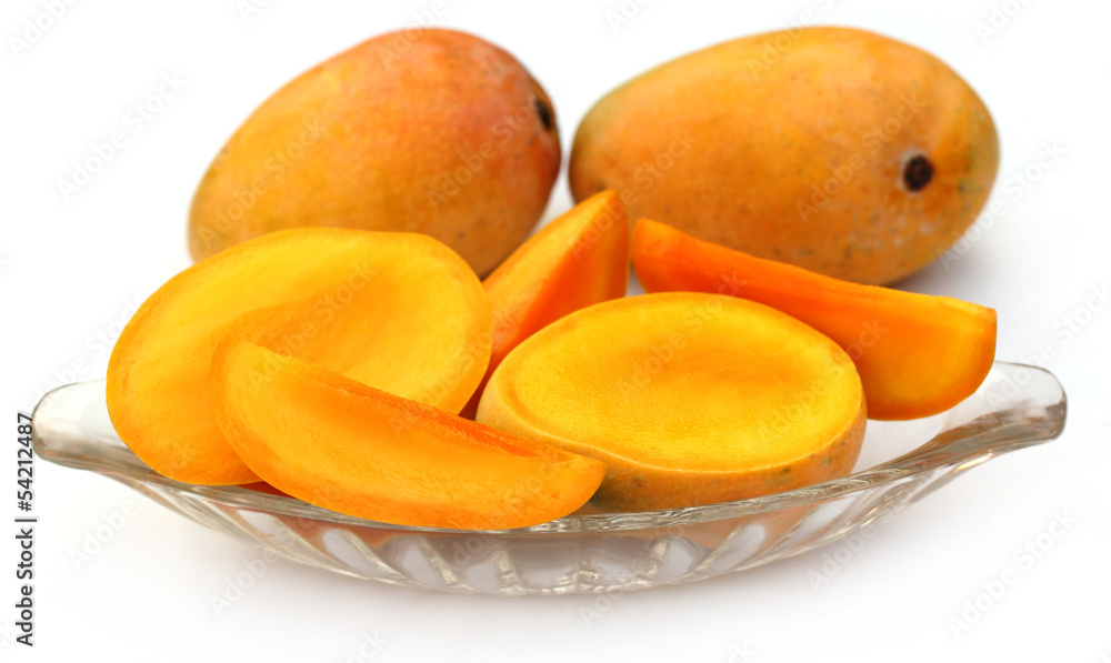 Fresh sliced Mangoes with whole ones