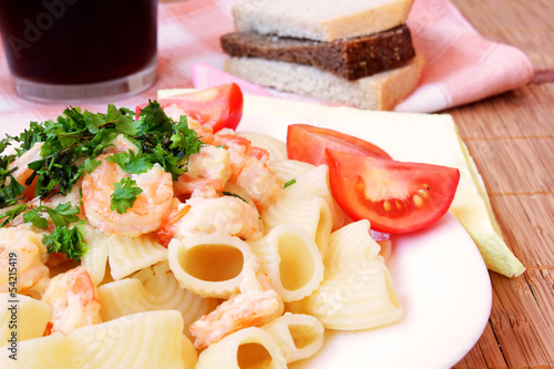 delicious pasta with shrimps, cheese and sour cream sauce