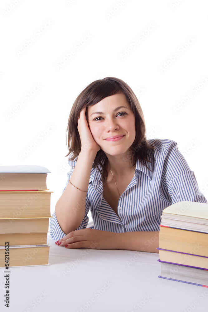 Student girl sitting with pile of books Student girl sitting with pile of books