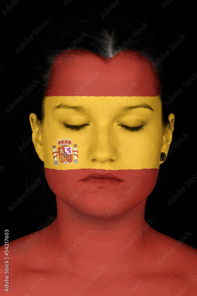 woman with the flag of Spain painted on her face. woman with the flag of Spain painted on her face.