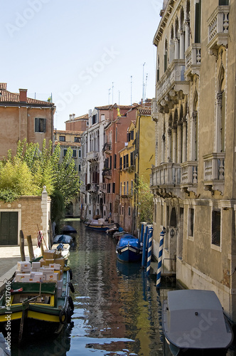 Canal with boats in Venice