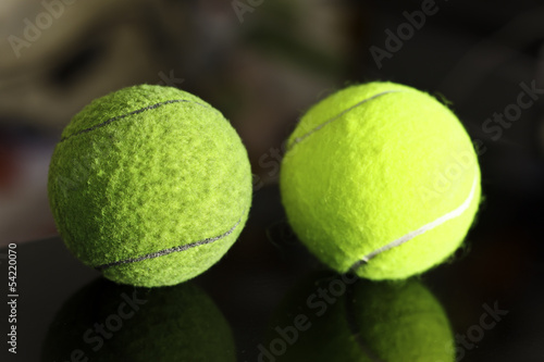 tennis in dark shadow