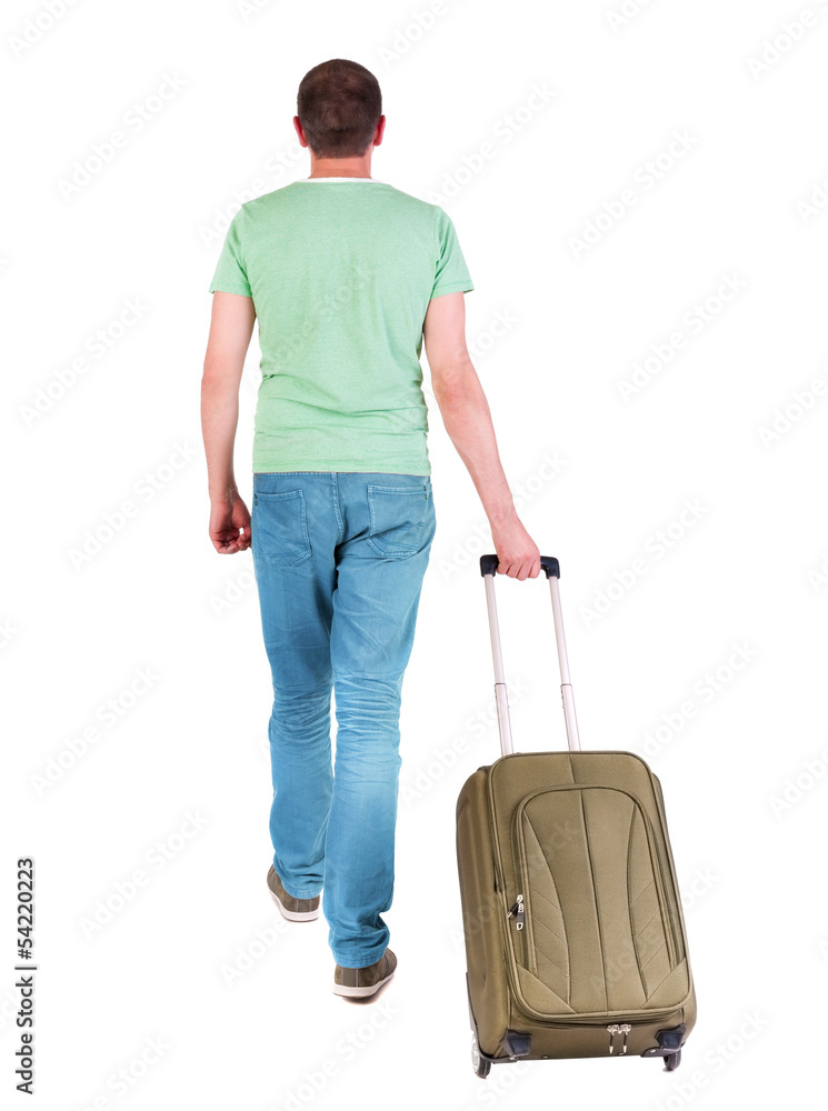 back view of walking  man  with suitcase.