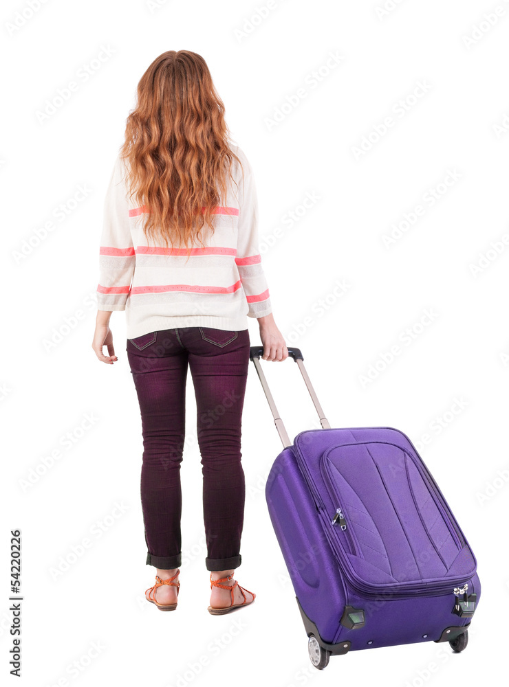 back view of walking woman with suitcase. back view of walking woman with suitcase.