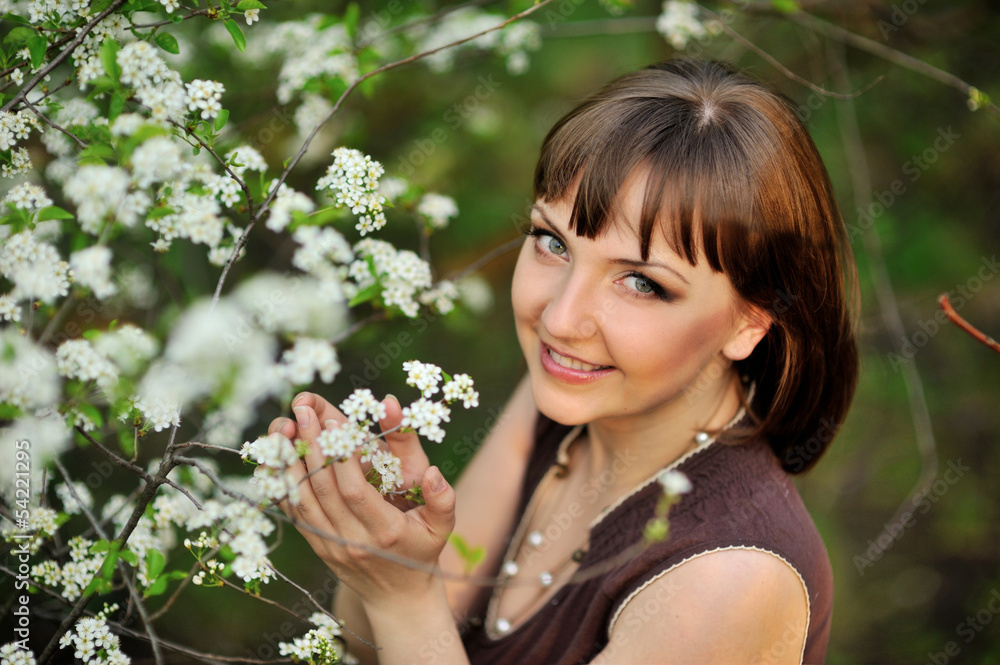 beautiful young brunette woman standing near tree beautiful young brunette woman standing near tree