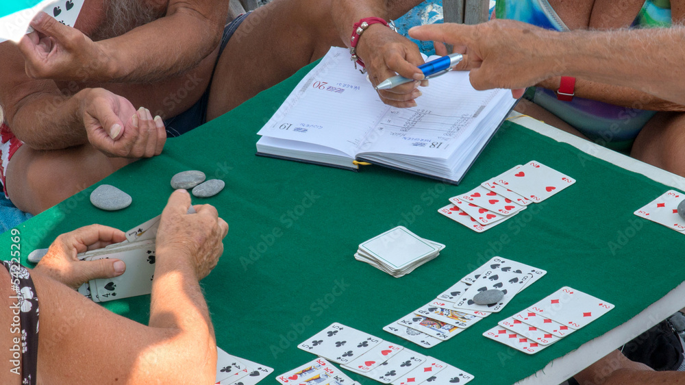 Obraz premium playing cards on the beach