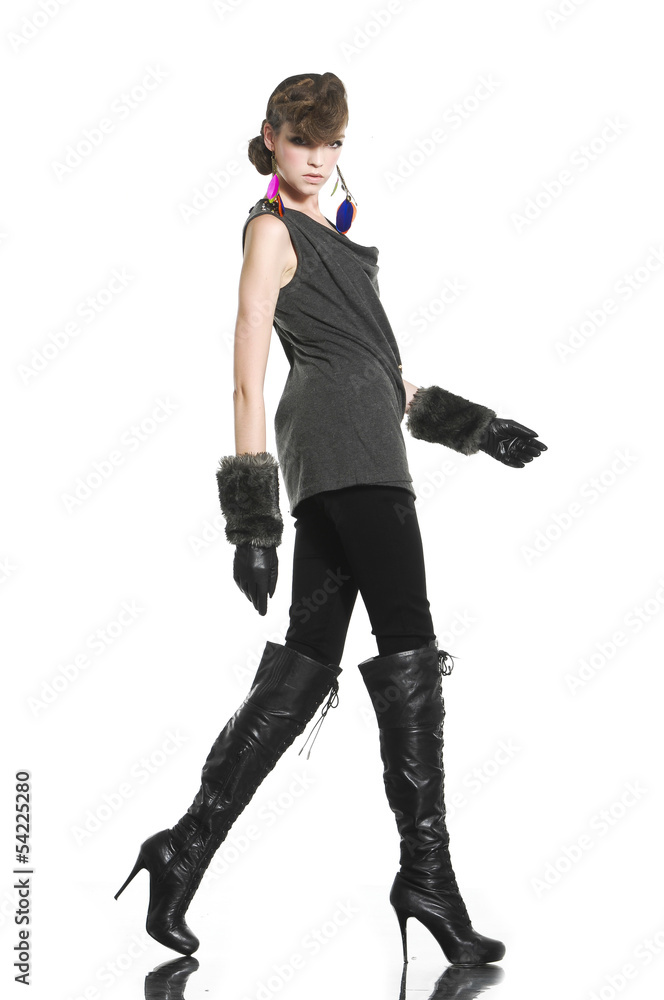 Beautiful fashion casual girl in gloves walking posing Beautiful fashion casual girl in gloves walking posing